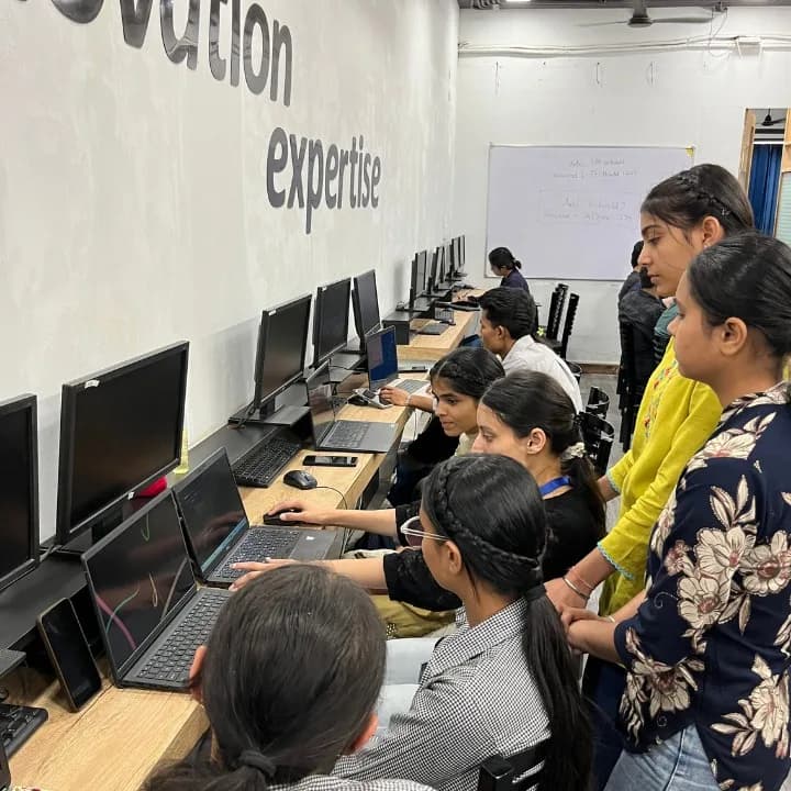 TechCADD students working at the lab benches, laptops and monitors along the wall