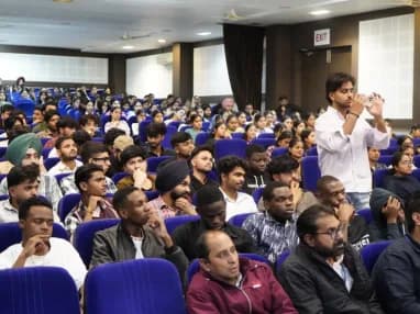 A full auditorium of TechCADD students during a training session